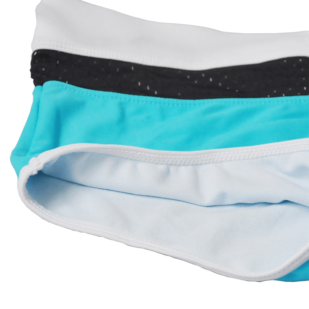 Colorful men's drawstring low waist beach boxers for swimming with patchwork design and blue accents, made of 100% polyester.